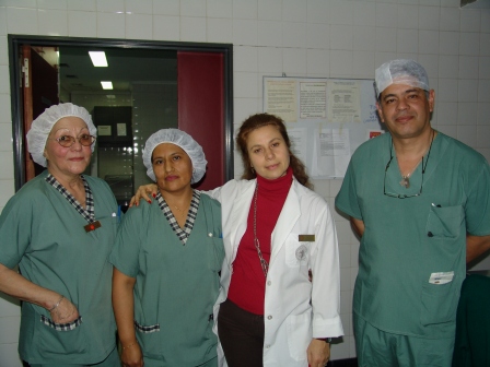 a group of doctors with one in green and the other in white