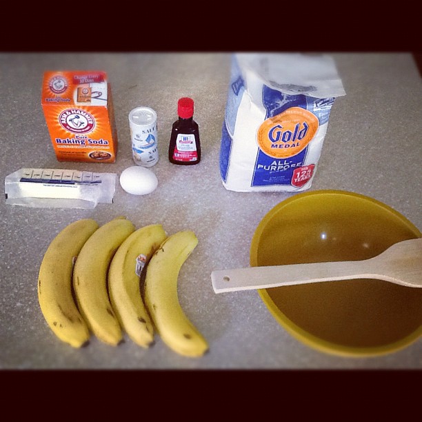 ingredients for baking bread, including bananas and milk