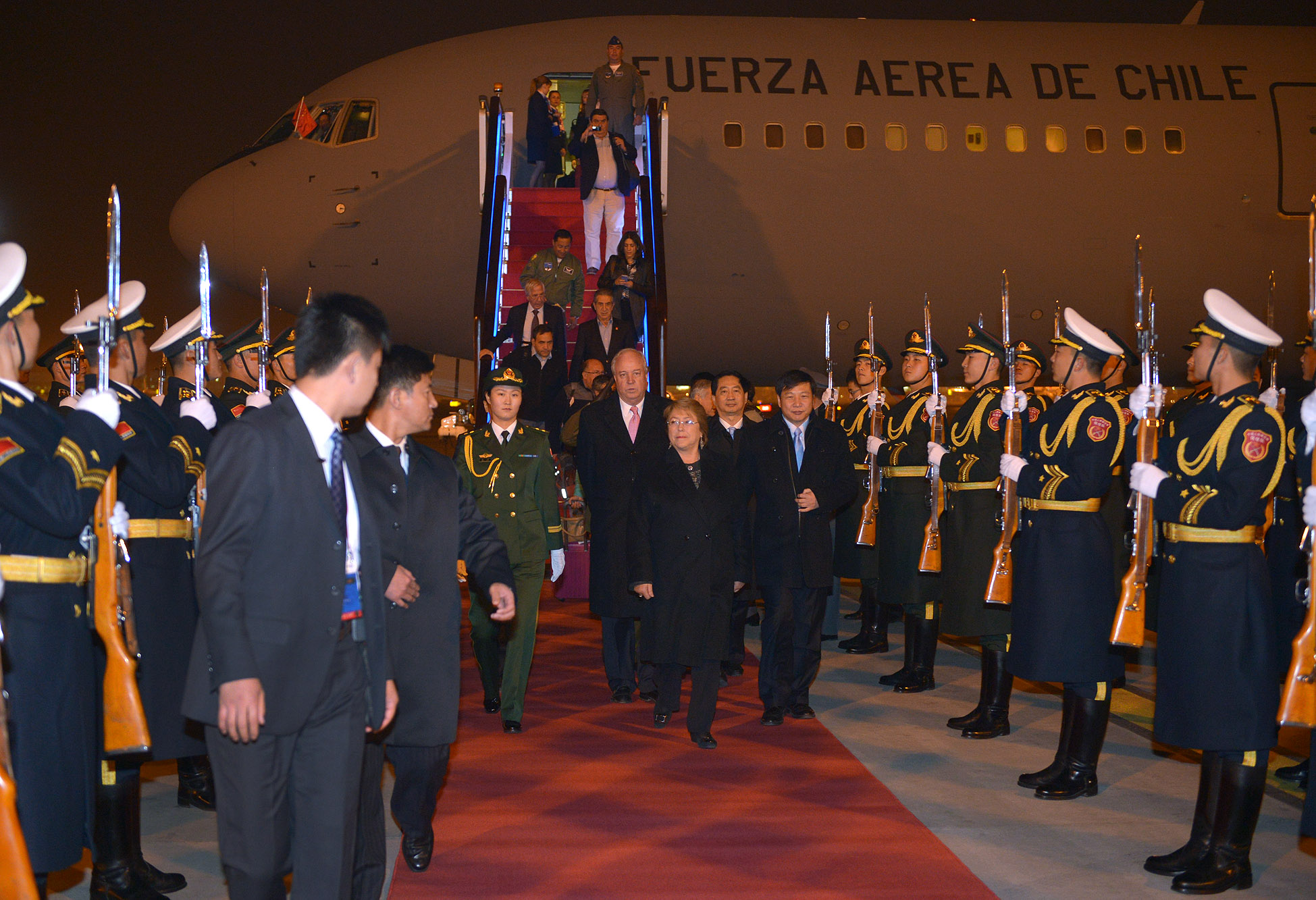 the chinese officials are escorted by foreign officials