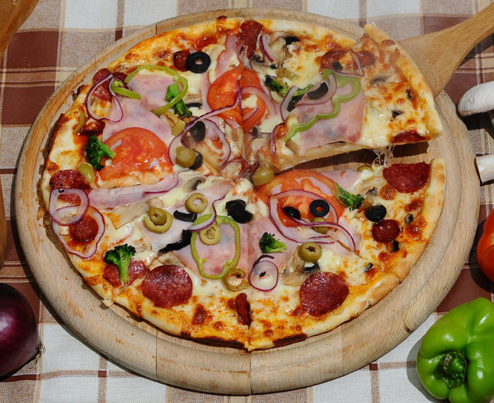 a pizza that is sitting on a board