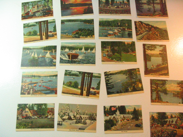 a white wall with several pictures of boats