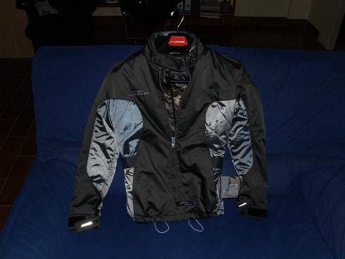 jacket with reflective sleeves, zippers and patches on the front