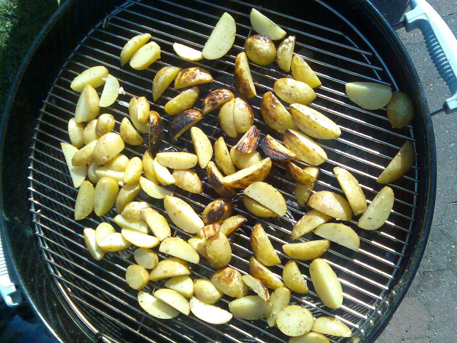 some potatoes on a grill grill outside