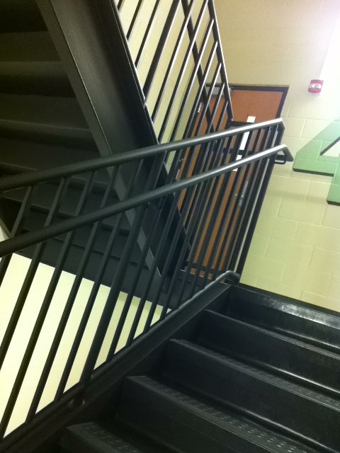 an image of a black railing and stairs