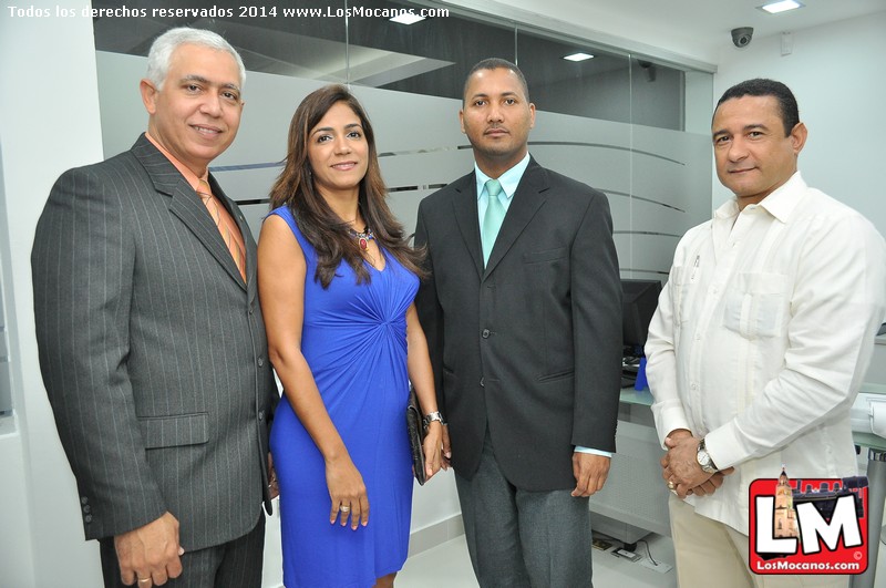 a group of people wearing suits in front of a building