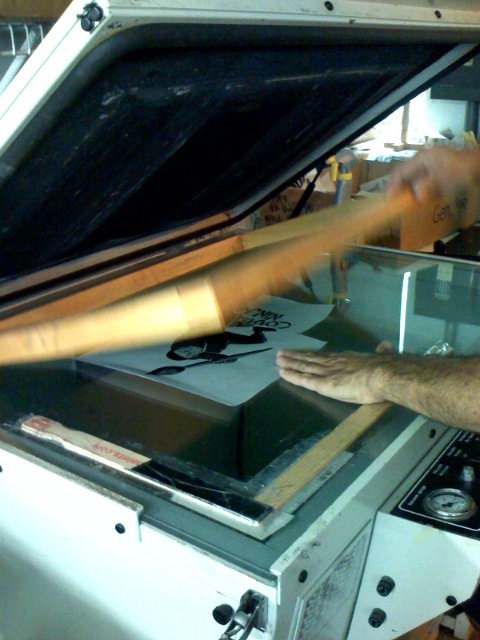 a close up of a person pulling some wood out of an oven