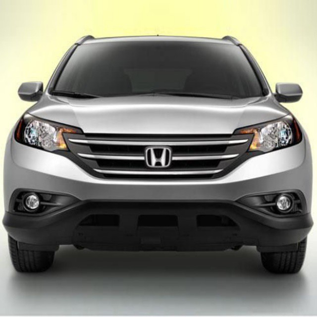 the front end of a silver honda cr - v