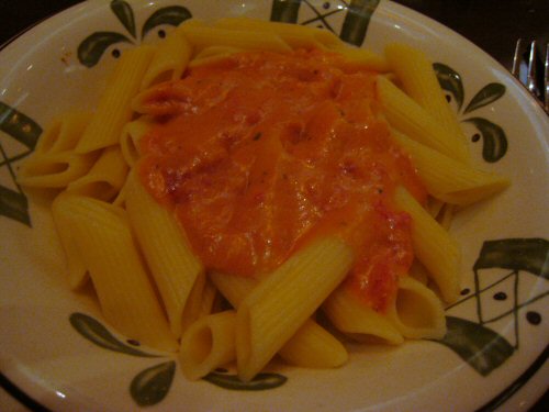 a plate of pasta on a decorative plate