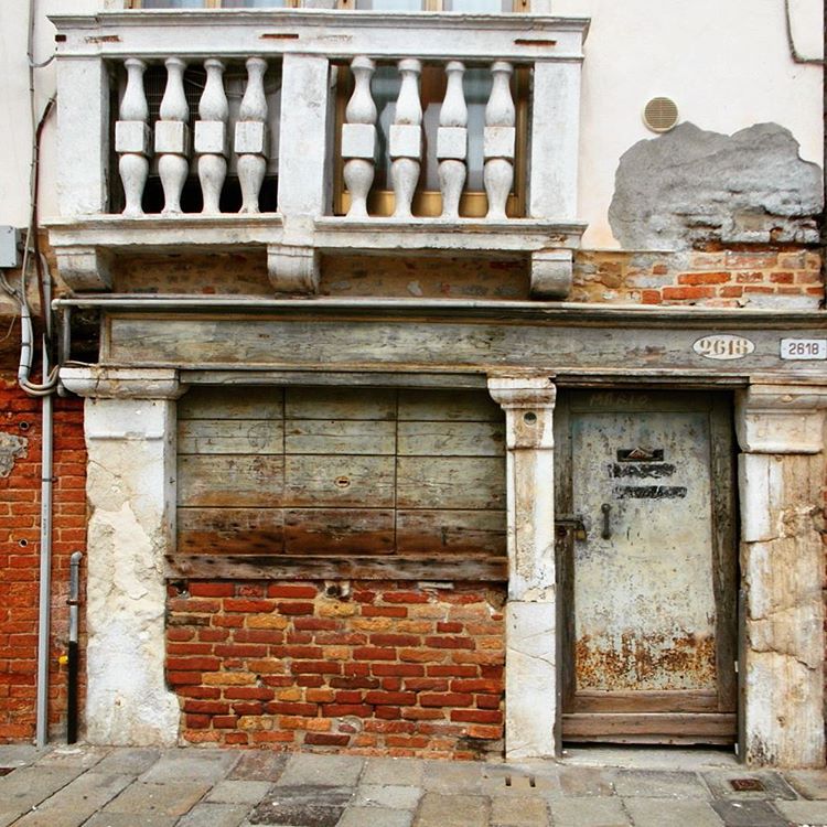 a closed garage in front of an apartment building