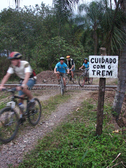 men on bikes are riding on a trail in the mountains