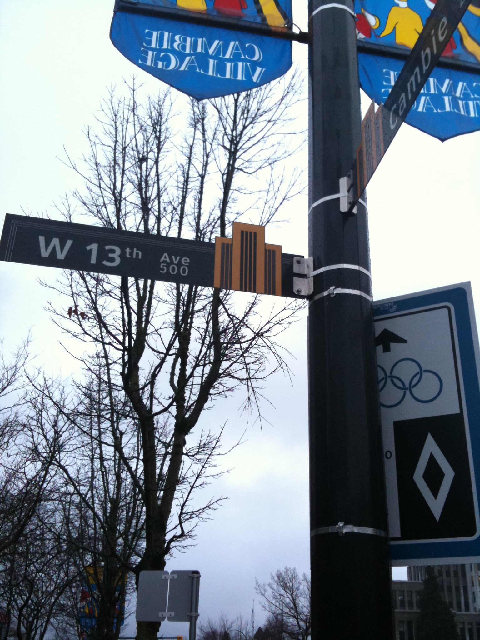 an intersection with street signs and other signs