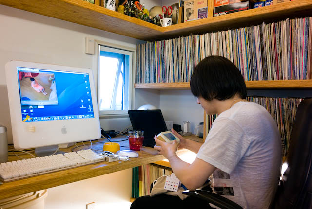 a person at a desk with a monitor and keyboard