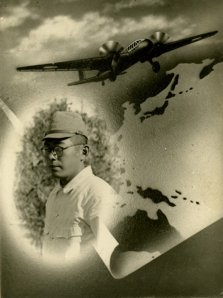 a man in a hat, glasses and baseball cap next to an airplane