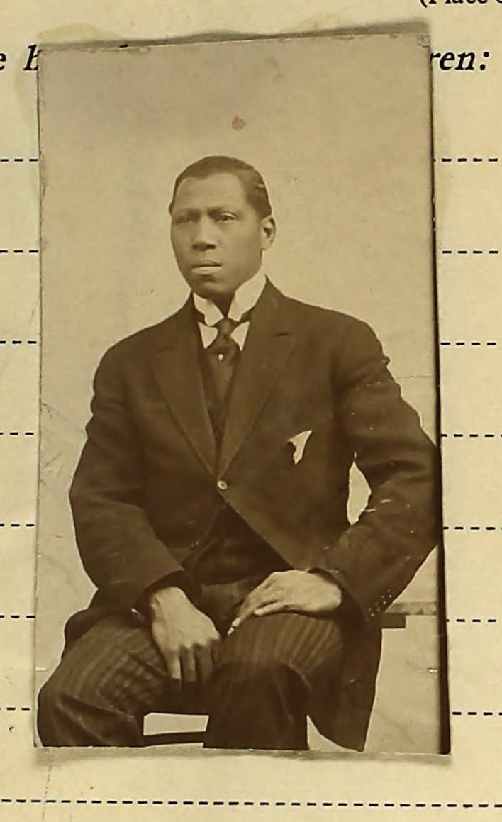 a black and white po of a man in a suit