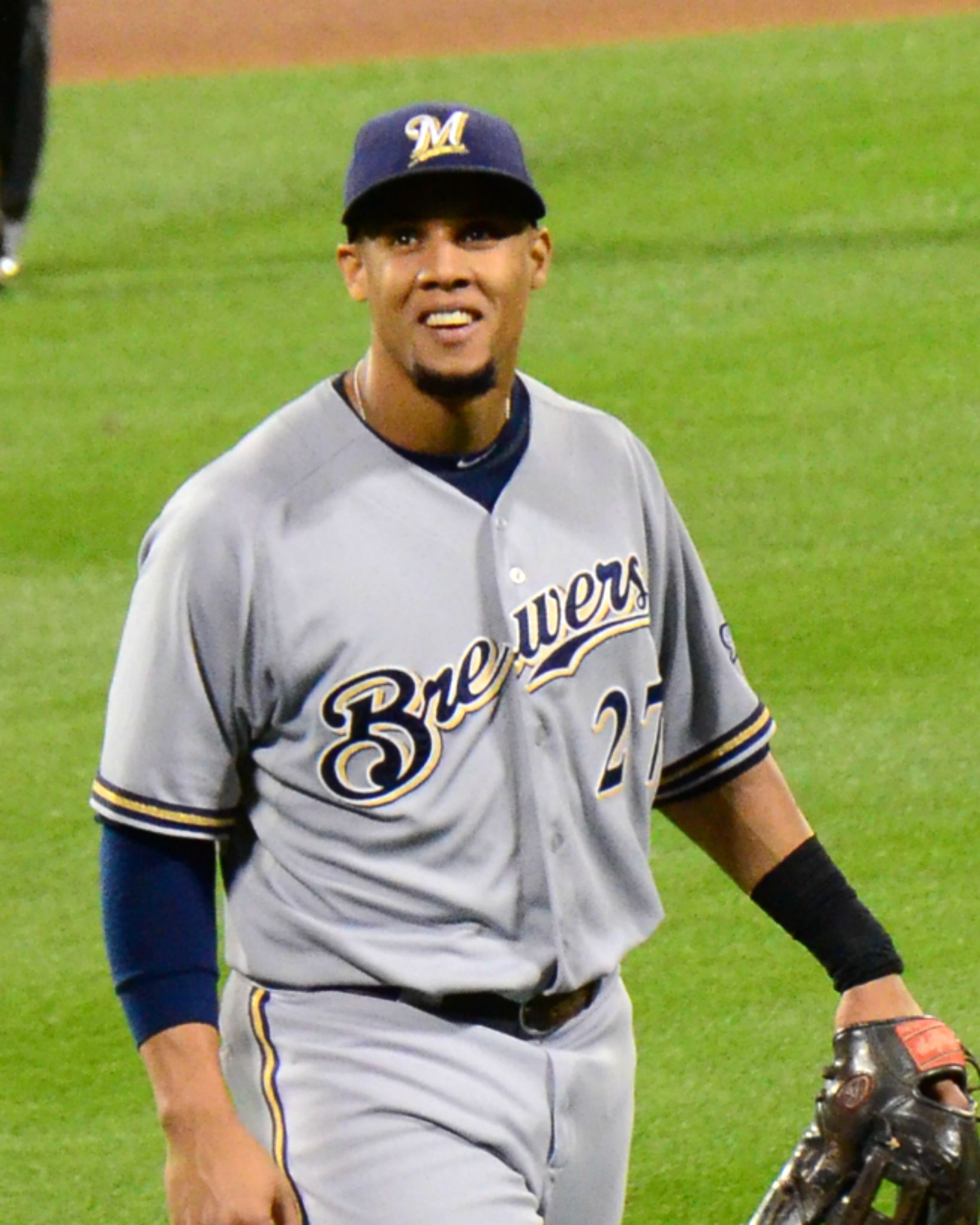 a professional baseball player stands on a baseball field