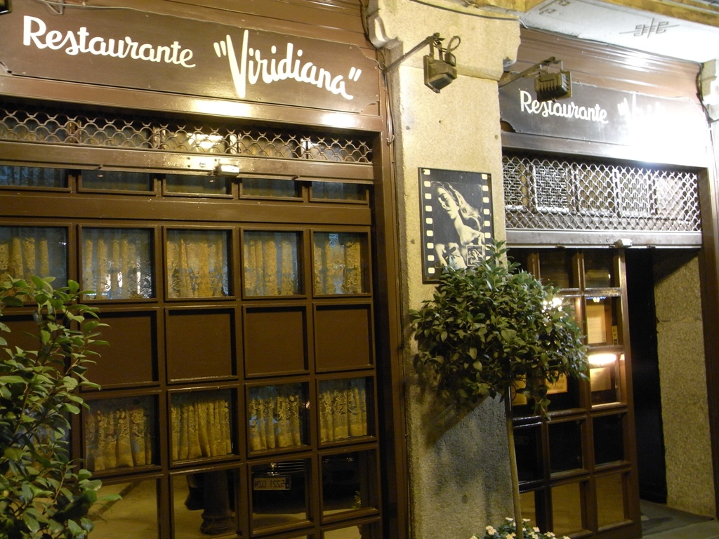 a building with large bookshelves next to a door