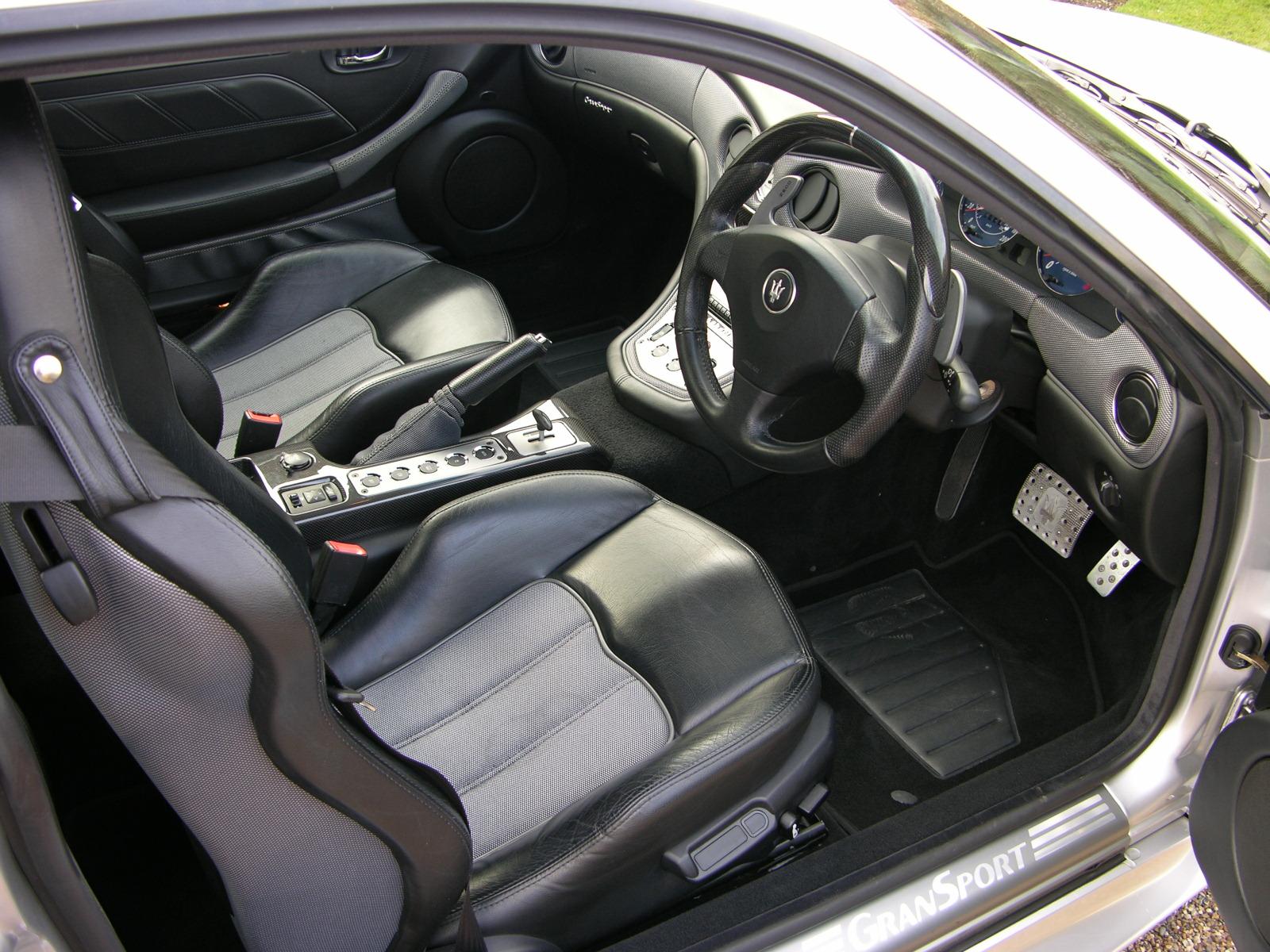 interior of a vehicle with a dashboard and several accessories