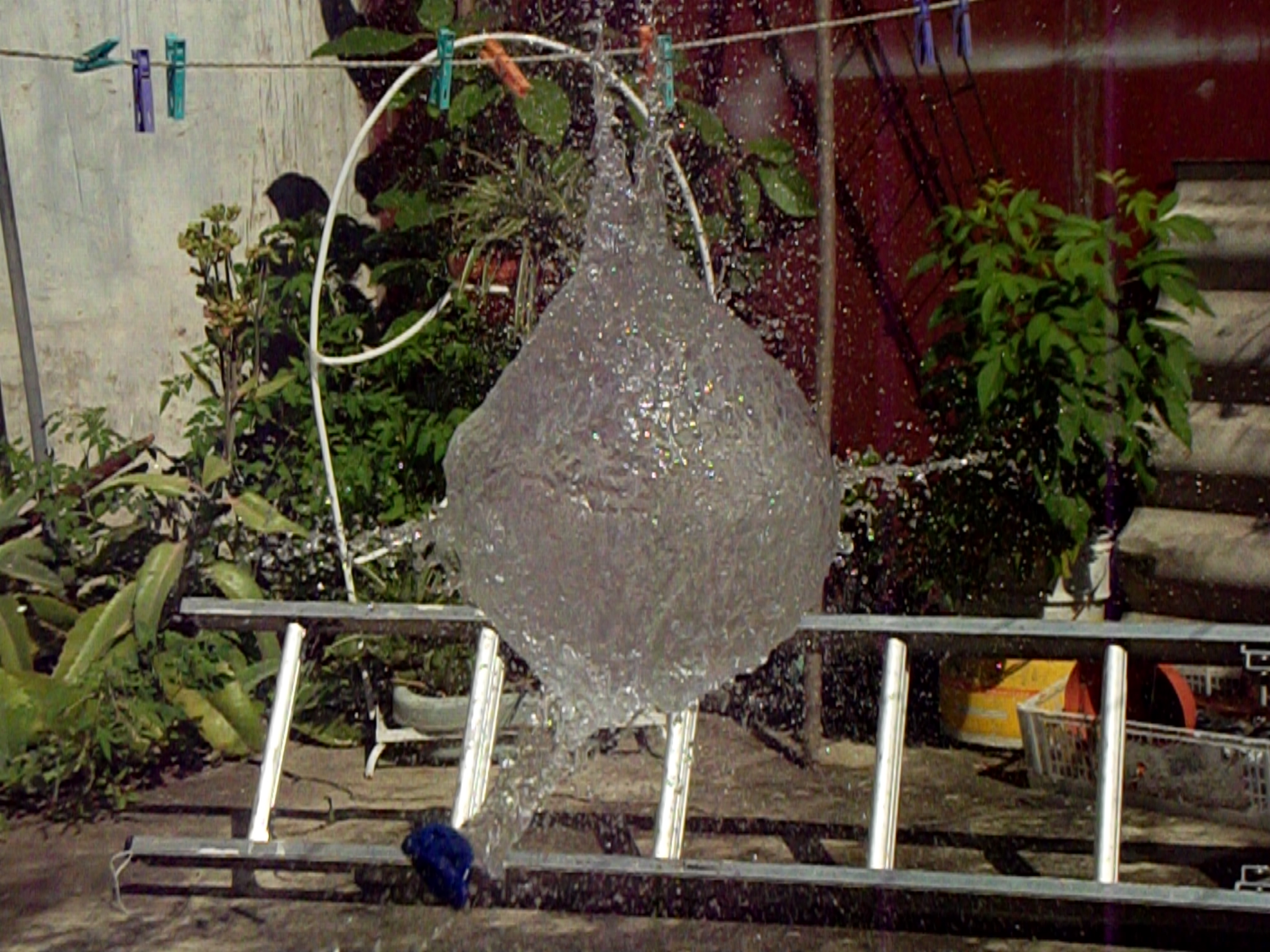 the large vase is being sprayed with water