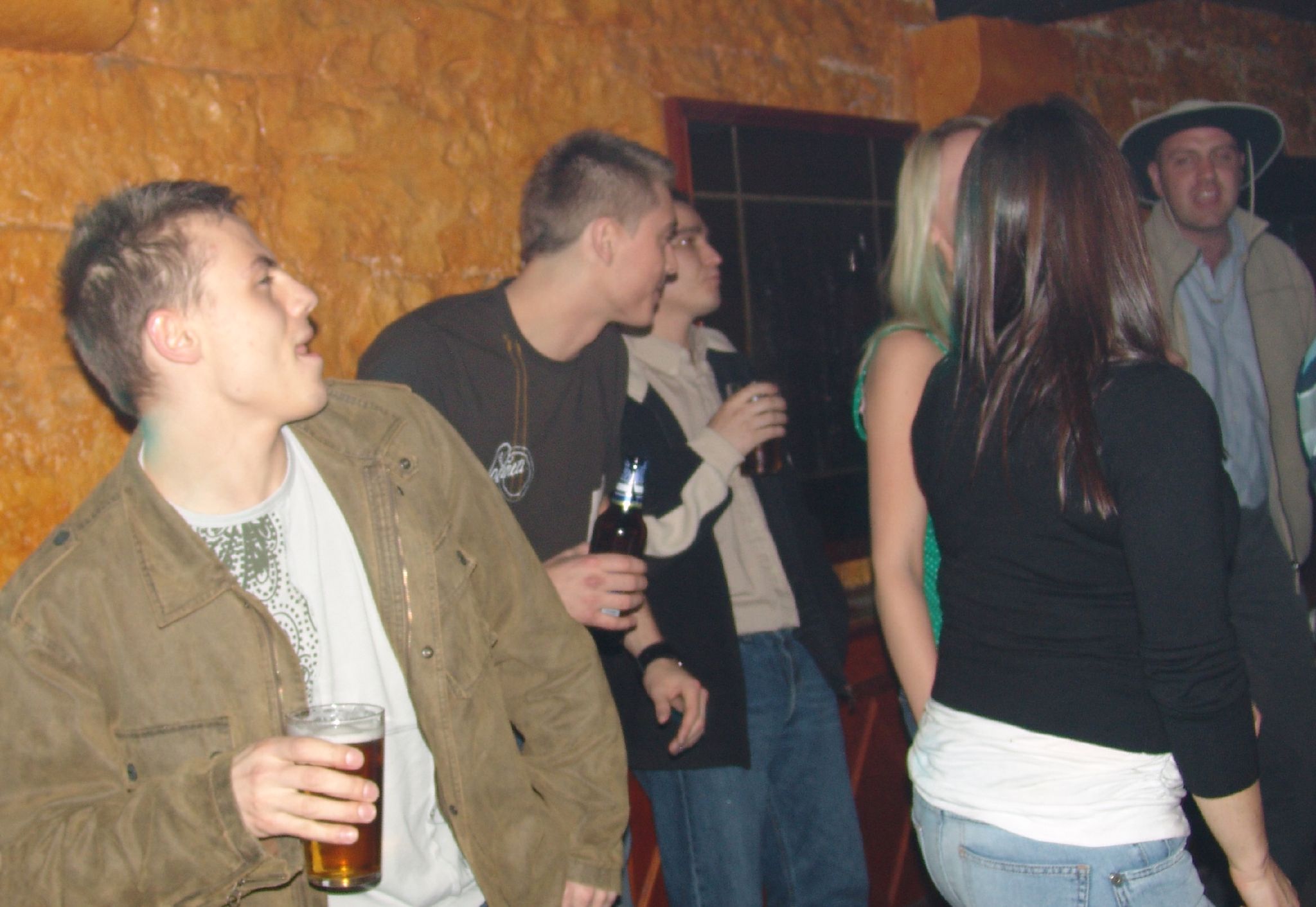 a group of people drinking and smiling at one another