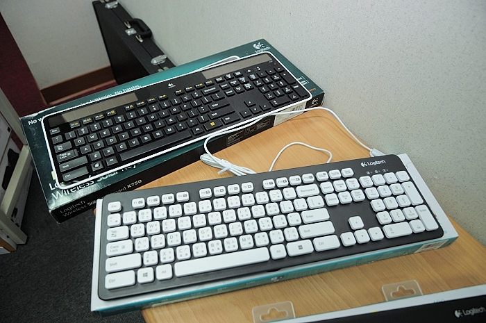 a keyboard and a computer mouse on a desk