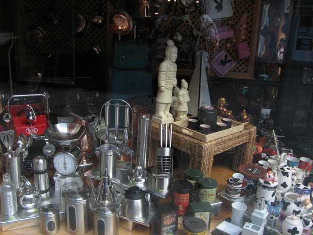 many items inside a glass window with one person
