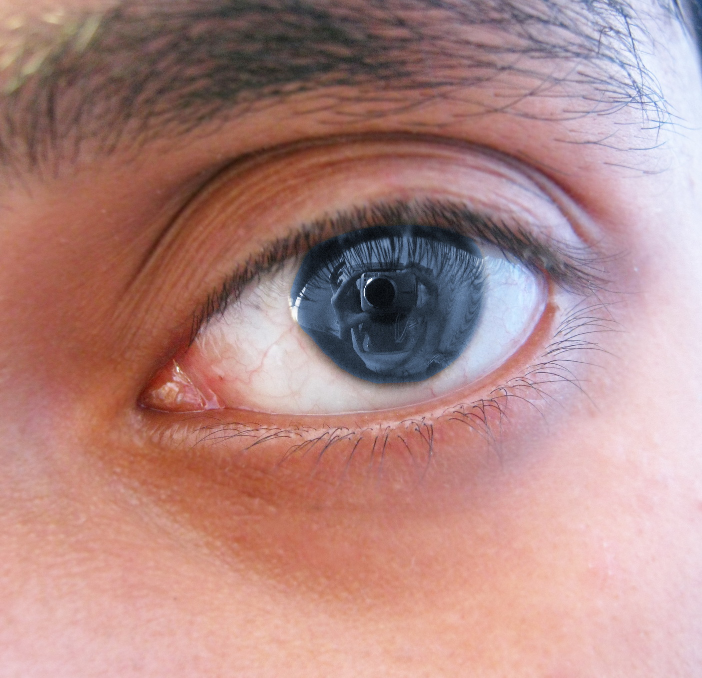 a blue eye with an orange cat eyeball