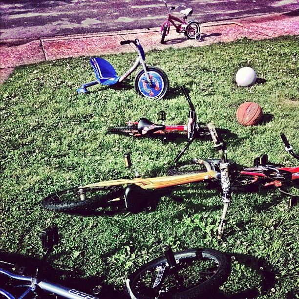 a bike and some bicycles in the grass