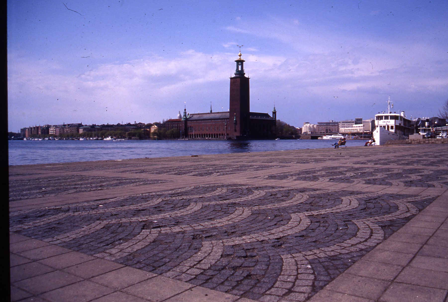 an intricate pathway is on the beach of a city