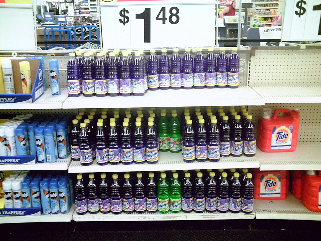 bottles of water sit on a store shelf