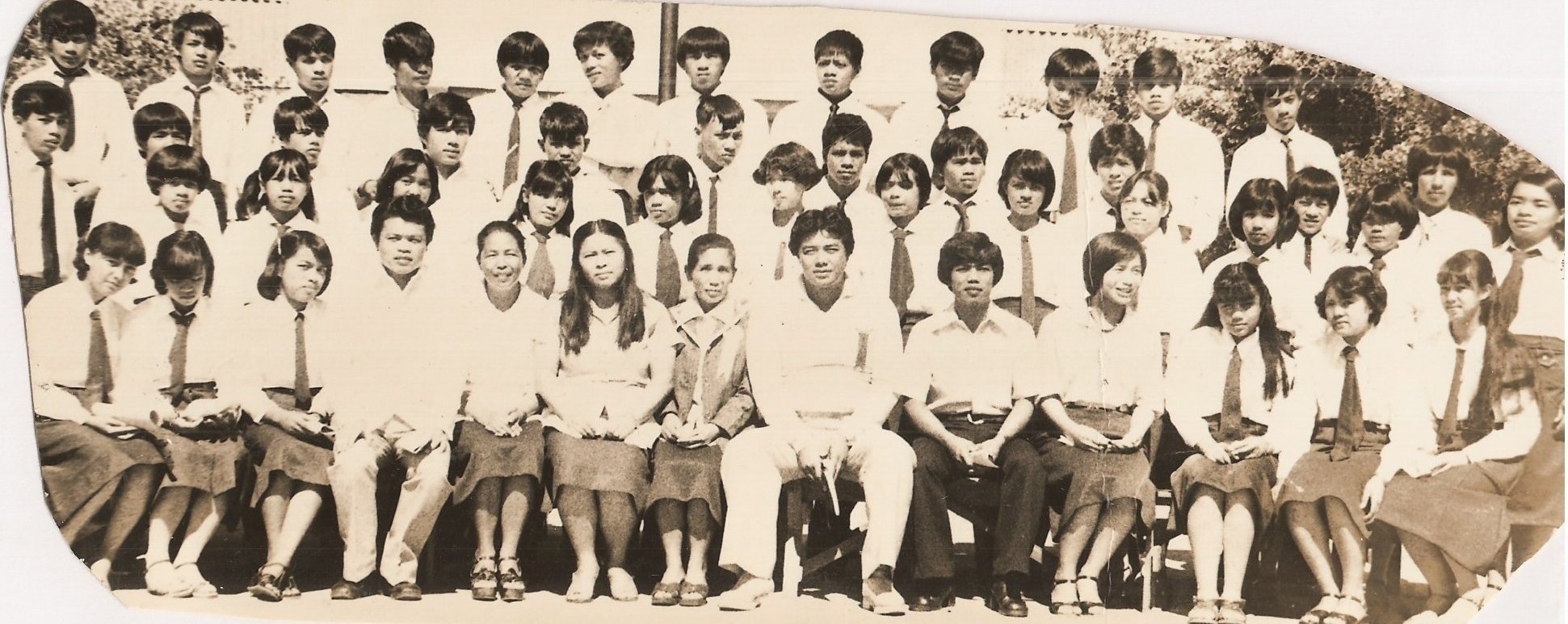 a group of children and adults standing next to each other