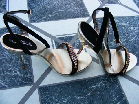 a close - up of a pair of shoes on a tiled surface