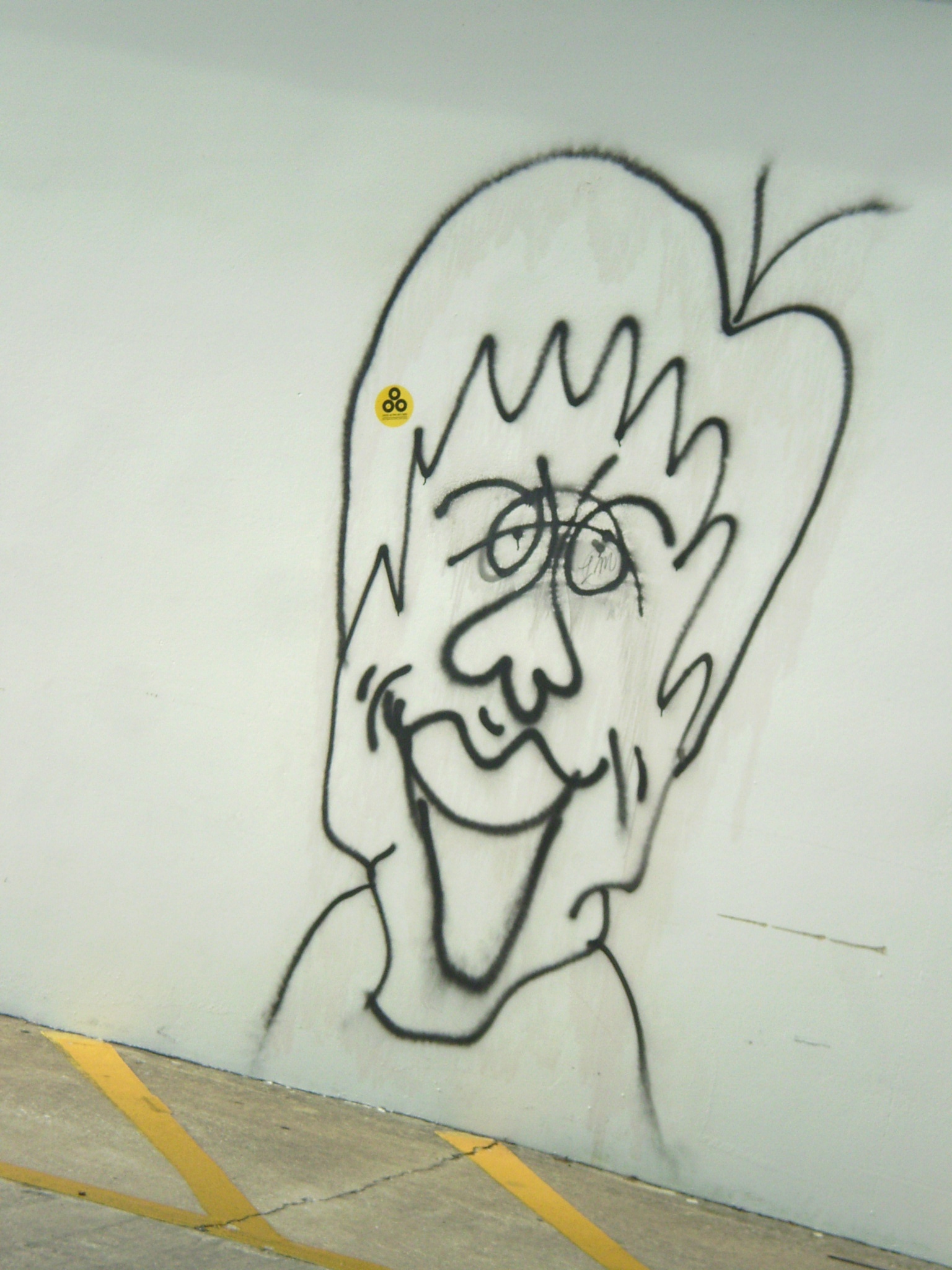 a graffiti painting of a man with glasses and a beard