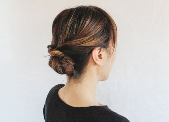 a woman with her hair pulled in a bun