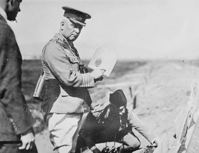 black and white po of a soldier holding paper