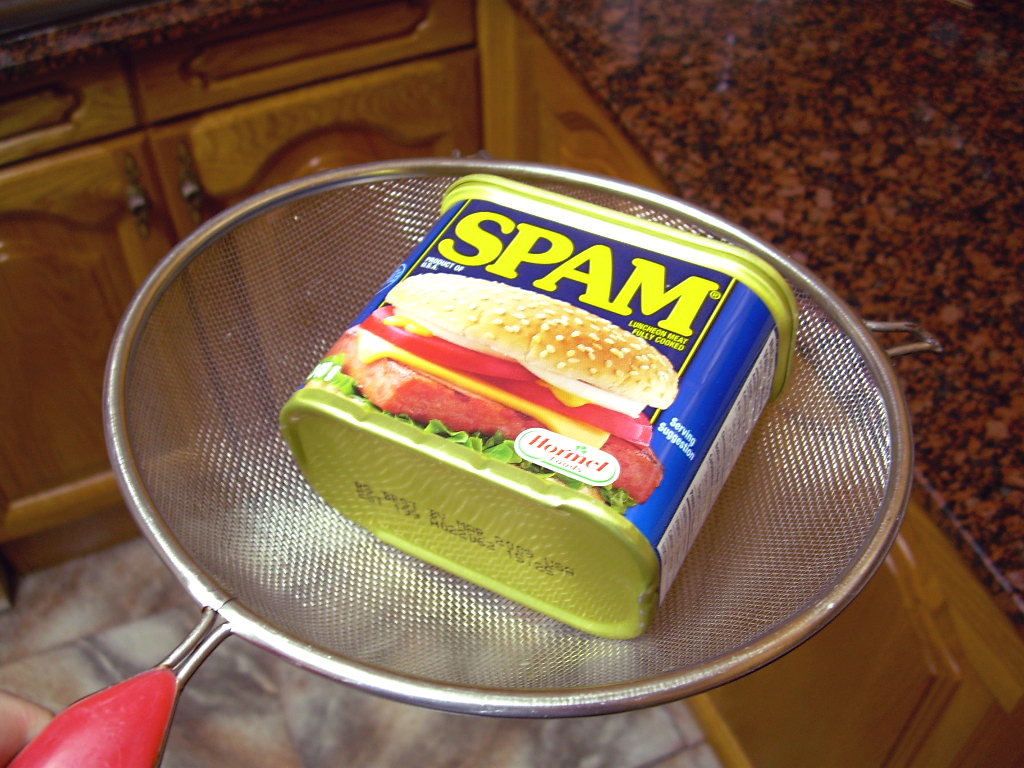 a container of spam on top of a cooling rack