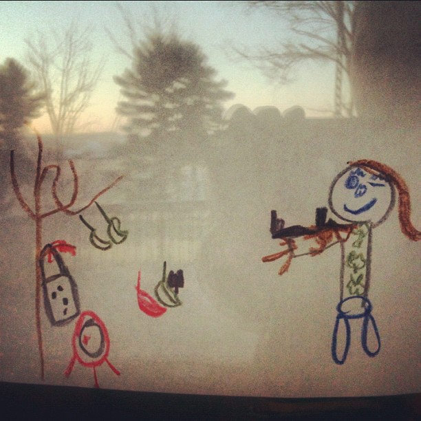 children's drawings of a man and a woman in the window