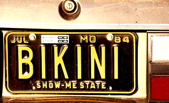 a plate on the back of a vehicle that reads bikini