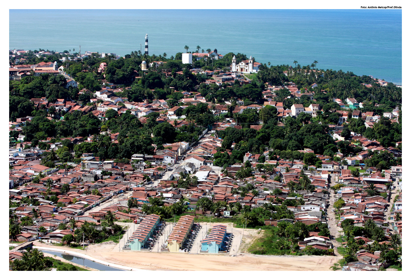 a small town surrounded by water and trees