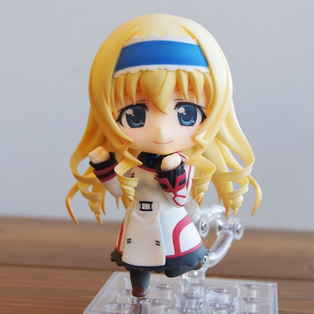 a girl that is on top of a glass stand
