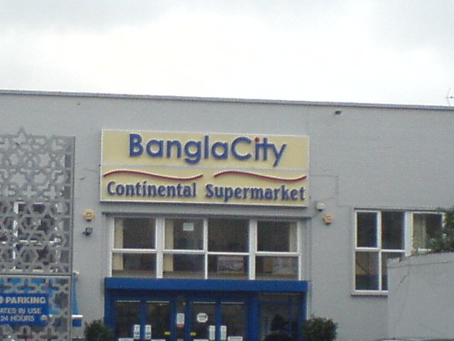 a store front with the words bangla city in large windows
