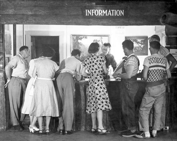 a group of people standing at a counter