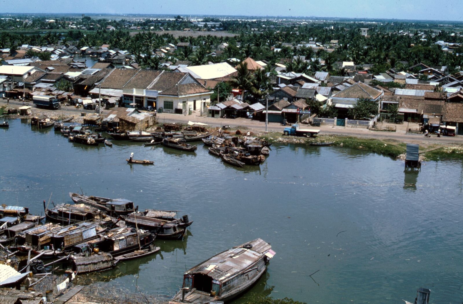 a small boat is docked at a harbor