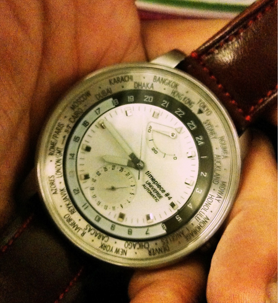closeup po of a watch being held by a person