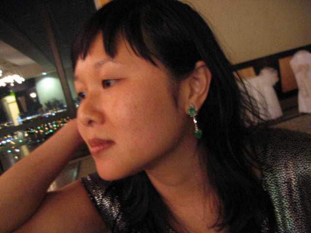 woman with large earrings looking off into the distance