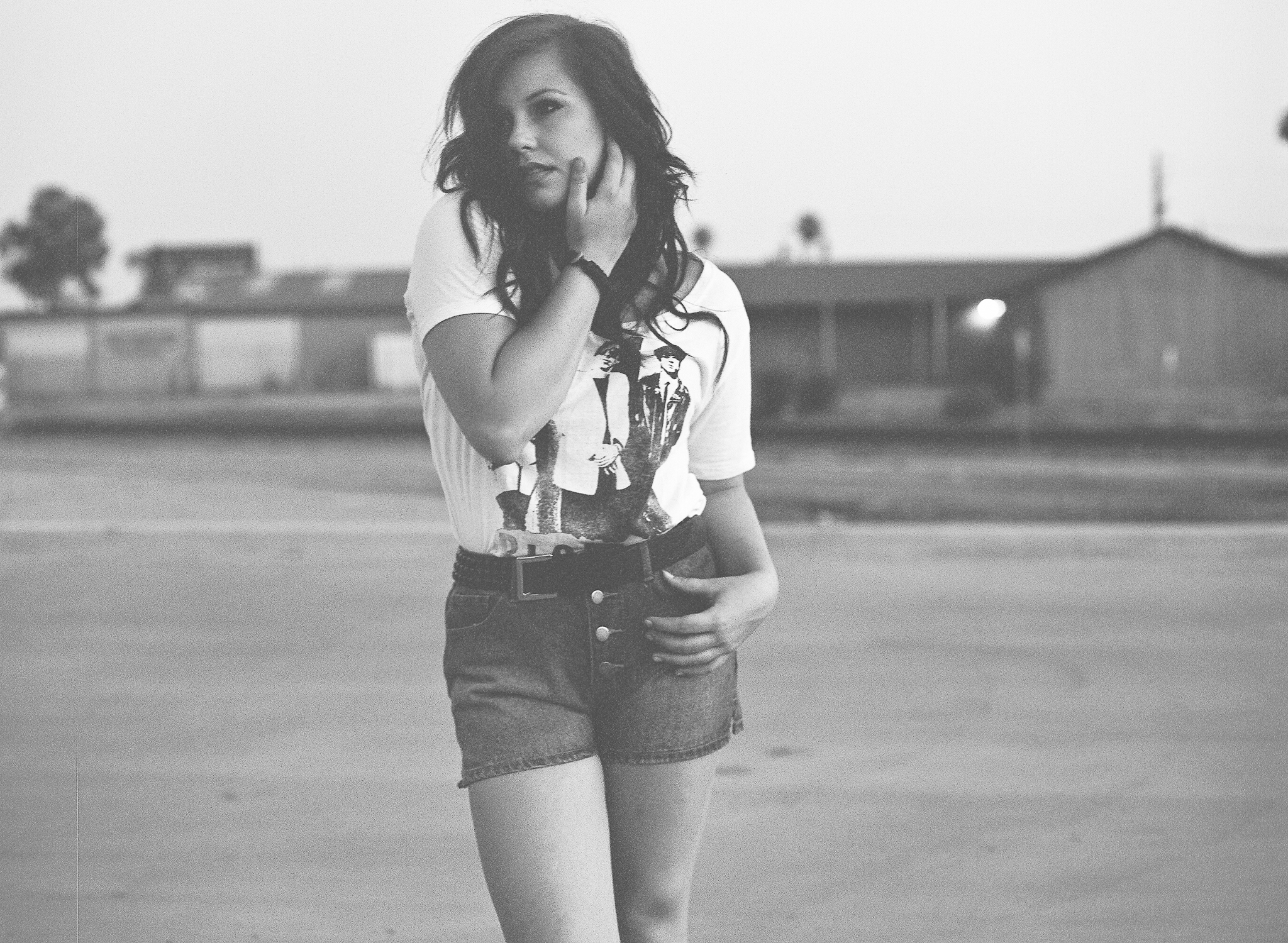 a woman on a skateboard posing for a picture