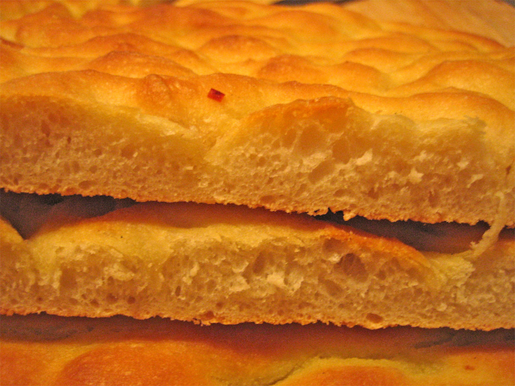 two pieces of bread sit on a surface