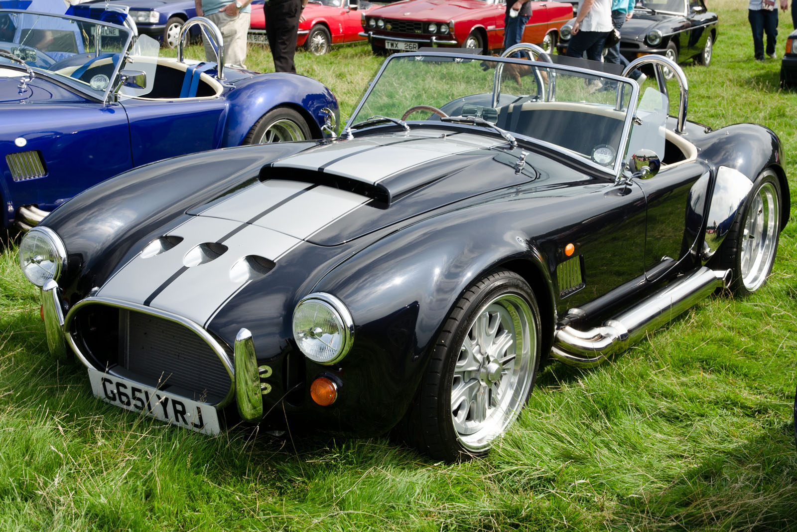 a black and gray sports car is on display
