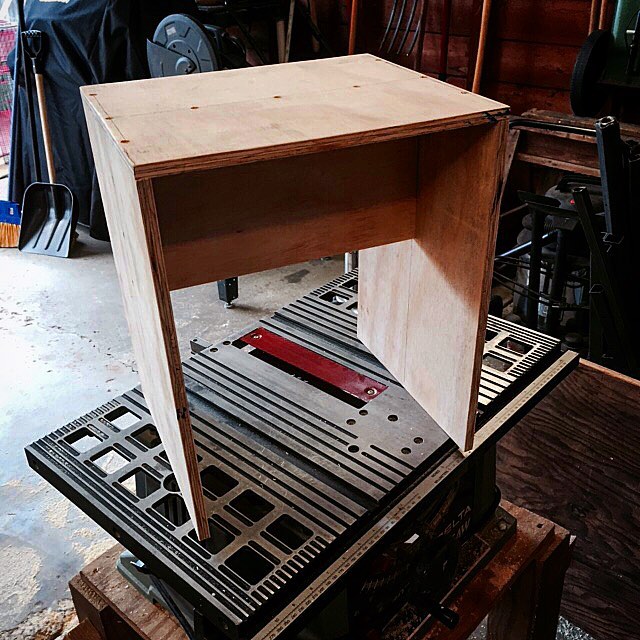 a piece of furniture sits on top of some pallets