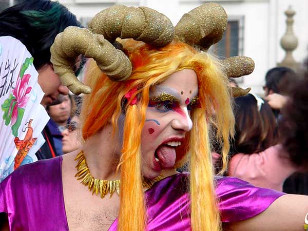 people in costumes are dressed up with horns and hair