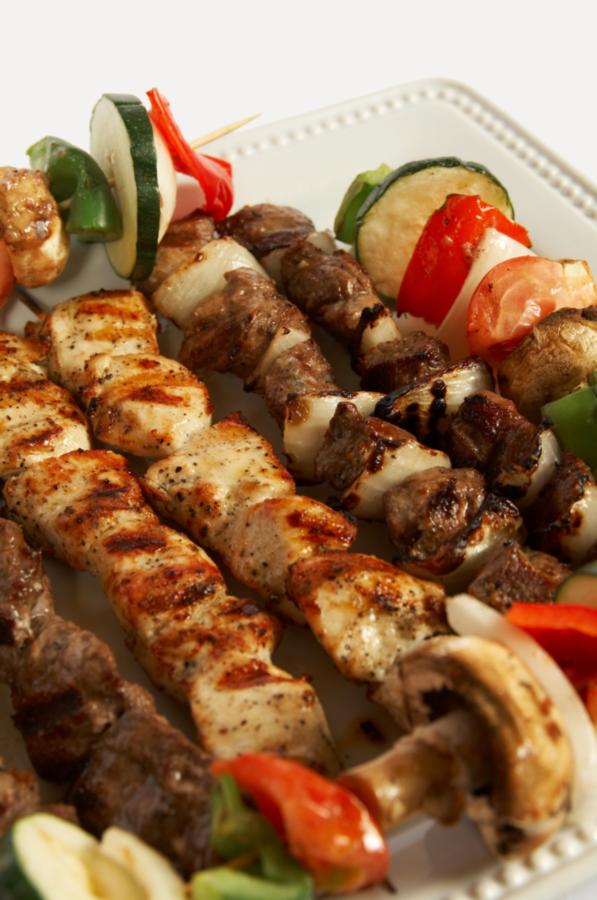 the kebabs are cooked on skewers on the plate